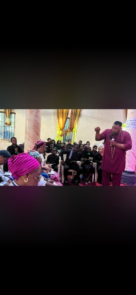 Prophet Ejike Nwachukwu speaking to a seated gathering